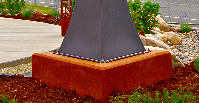 Wind Harp Base Secured to a Concrete Footer